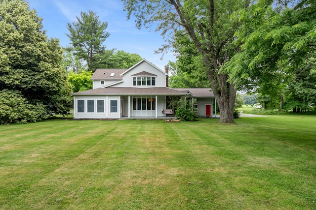 9719 King Rd, Spring Arbor, MI 49283 - view of front of house featuring a front lawn, a shingled roof, and a chimney