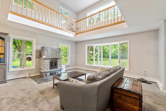 9719 King Rd, Spring Arbor, MI 49283 - carpeted living room with a baseboard heating unit, a high ceiling, and a stone fireplace