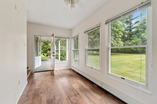 9719 King Rd, Spring Arbor, MI 49283 - unfurnished sunroom with a baseboard heating unit, plenty of natural light, hardwood / wood-style flooring, and french doors