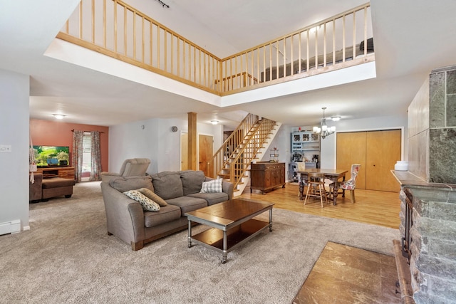 9719 King Rd, Spring Arbor, MI 49283 - living area featuring stairs, a high ceiling, and a chandelier
