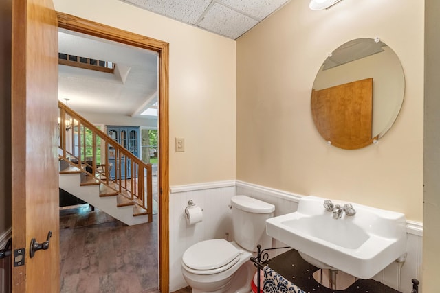 9719 King Rd, Spring Arbor, MI 49283 - half bathroom with a wainscoted wall, a paneled ceiling, and wood finished floors