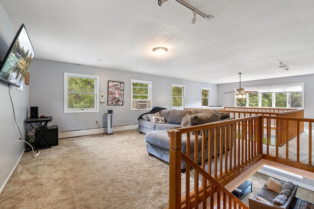 9719 King Rd, Spring Arbor, MI 49283 - carpeted living room with track lighting, a baseboard heating unit, a ceiling fan, and cooling unit