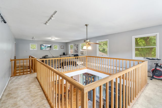 9719 King Rd, Spring Arbor, MI 49283 - hall featuring an upstairs landing, track lighting, carpet flooring, and cooling unit