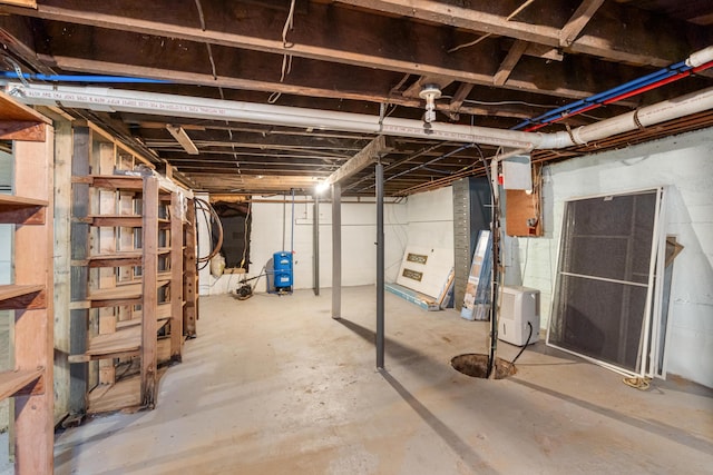 9719 King Rd, Spring Arbor, MI 49283 - unfinished below grade area with a water pressure tank