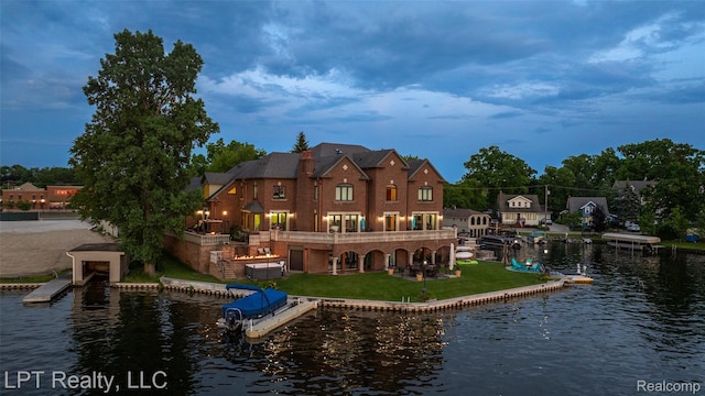 328 S Broadway St, Lake Orion, MI 48362 - rear view of property with a water view and a yard
