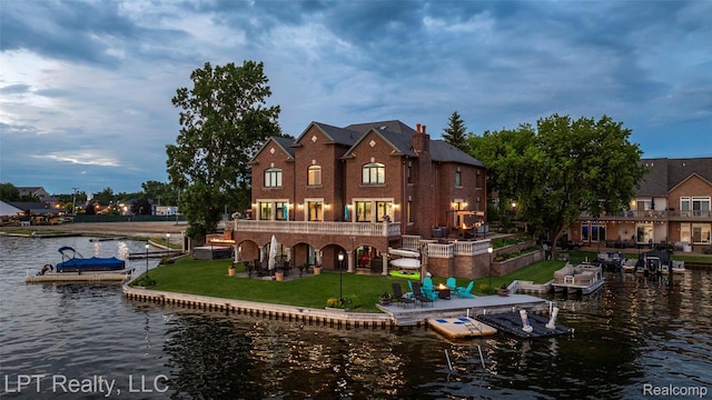 328 S Broadway St, Lake Orion, MI 48362 - rear view of property featuring a water view, a yard, and a patio area