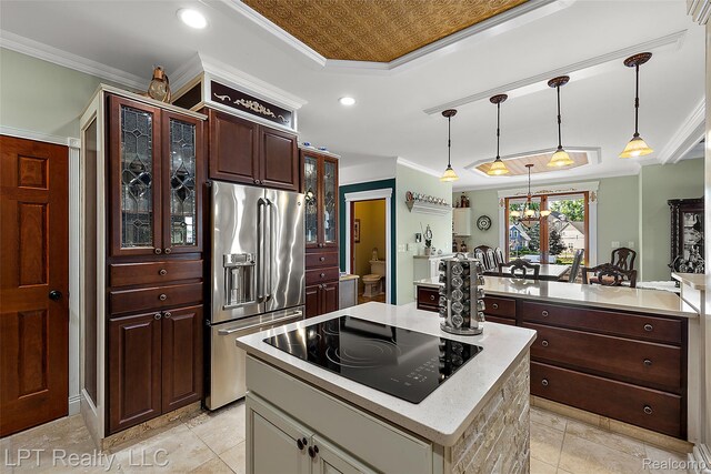 328 S Broadway St, Lake Orion, MI 48362 - kitchen with high end fridge, black electric stovetop, a kitchen island, ornamental molding, and light countertops
