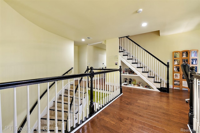 328 S Broadway St, Lake Orion, MI 48362 - corridor featuring wood finished floors, recessed lighting, and stairway