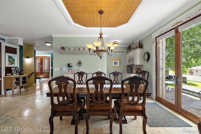 328 S Broadway St, Lake Orion, MI 48362 - dining area featuring a tray ceiling, french doors, a chandelier, light tile patterned flooring, and ornamental molding