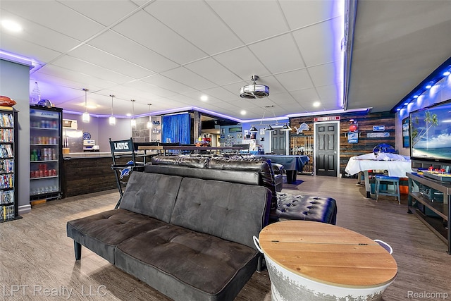328 S Broadway St, Lake Orion, MI 48362 - rec room featuring wood finished floors, a paneled ceiling, and a community bar