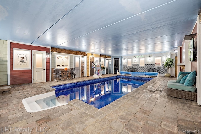 328 S Broadway St, Lake Orion, MI 48362 - indoor pool featuring a hot tub, a patio area, and outdoor dining area