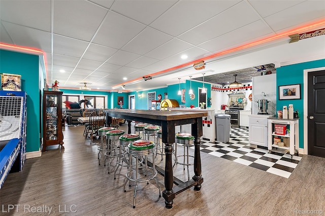 328 S Broadway St, Lake Orion, MI 48362 - dining room with a drop ceiling and baseboards