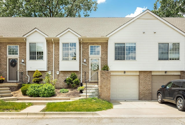 30921 Lee Frank Ln, Madison Heights, MI 48071 - view of front facade with brick siding, driveway, an attached garage, and a shingled roof