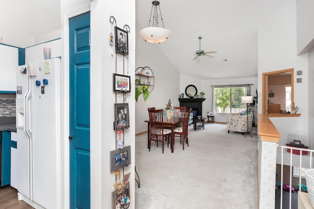 30921 Lee Frank Ln, Madison Heights, MI 48071 - carpeted dining space featuring a ceiling fan, a fireplace, and lofted ceiling