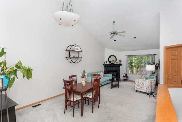 30921 Lee Frank Ln, Madison Heights, MI 48071 - carpeted dining space featuring lofted ceiling, a glass covered fireplace, and ceiling fan