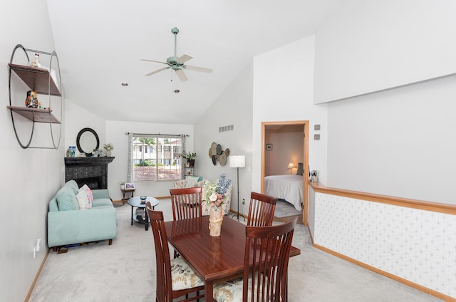 30921 Lee Frank Ln, Madison Heights, MI 48071 - carpeted dining area featuring a ceiling fan, high vaulted ceiling, and a glass covered fireplace