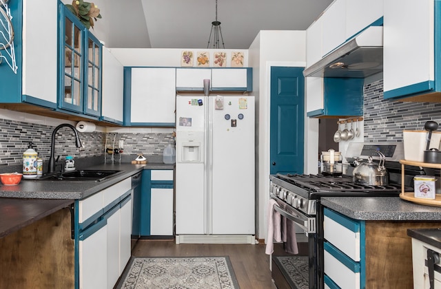 30921 Lee Frank Ln, Madison Heights, MI 48071 - kitchen with white refrigerator with ice dispenser, stainless steel gas range, dark countertops, and under cabinet range hood