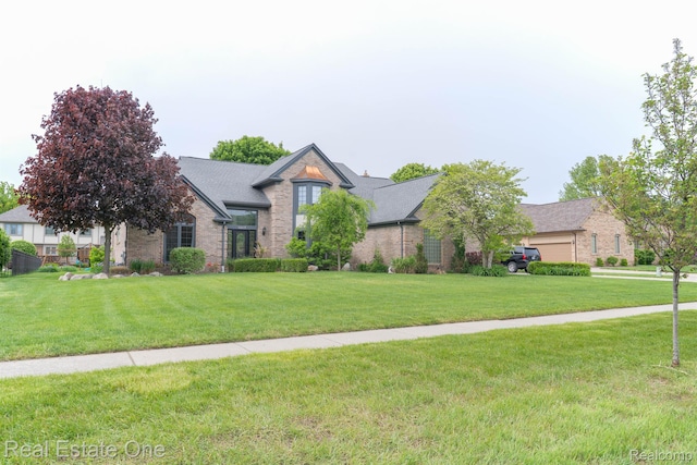 14607 Stratford, Shelby Twp, MI 48315 - view of front of house featuring brick siding and a front lawn