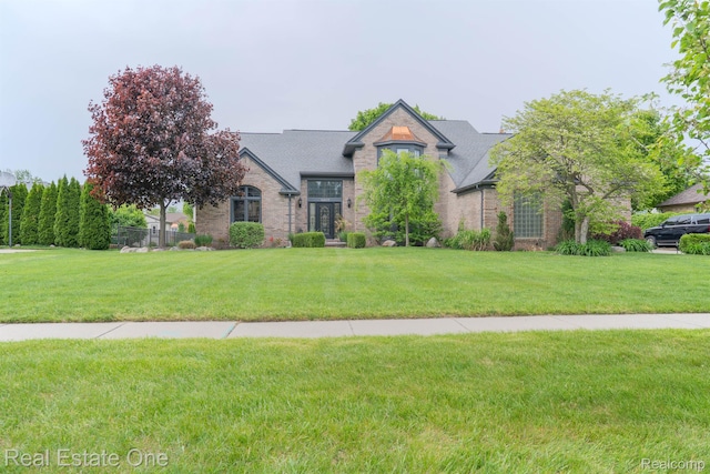 14607 Stratford, Shelby Twp, MI 48315 - view of front of home featuring brick siding and a front yard
