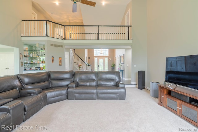 14607 Stratford, Shelby Twp, MI 48315 - carpeted living room featuring a towering ceiling, stairway, a ceiling fan, and bar