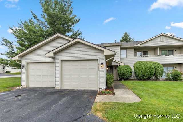 2685 Hillandale Dr NW, Walker, MI 49534 - view of property featuring driveway, a front lawn, and a garage