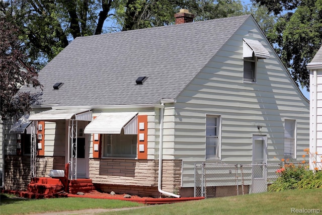 329 Bede St, Otisville, MI 48507 - view of front facade featuring a chimney and a shingled roof