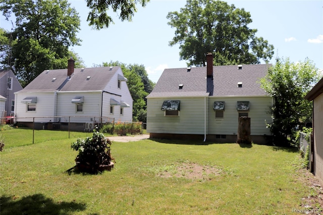 329 Bede St, Otisville, MI 48507 - rear view of house with a chimney