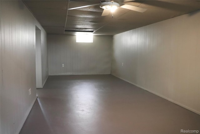 329 Bede St, Otisville, MI 48507 - below grade area featuring ceiling fan and wood walls