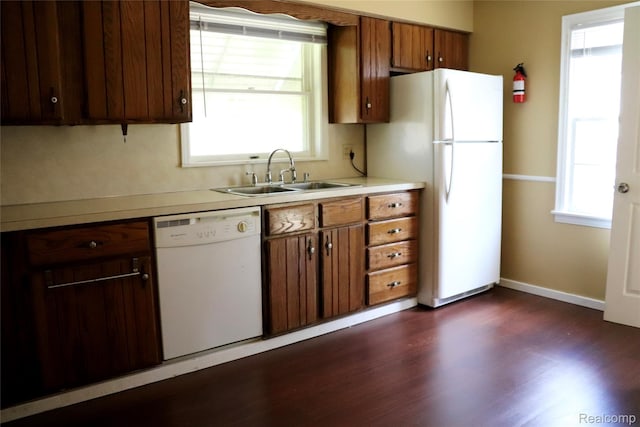 329 Bede St, Otisville, MI 48507 - kitchen featuring white appliances, light countertops, dark wood-style flooring, and brown cabinetry