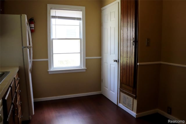 329 Bede St, Otisville, MI 48507 - kitchen featuring dark wood-type flooring, freestanding refrigerator, and light countertops