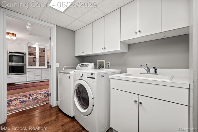 6847 Alden Dr, West Bloomfield, MI 48324 - laundry area with cabinet space, separate washer and dryer, and dark wood-type flooring
