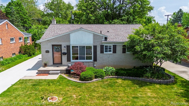 32204 Leelane, Farmington, MI 48336 - view of front of property featuring a shingled roof, a front lawn, and brick siding