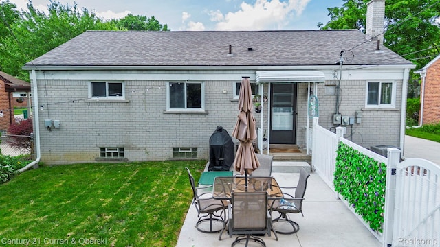 32204 Leelane, Farmington, MI 48336 - back of property featuring a chimney, brick siding, a patio area, and roof with shingles