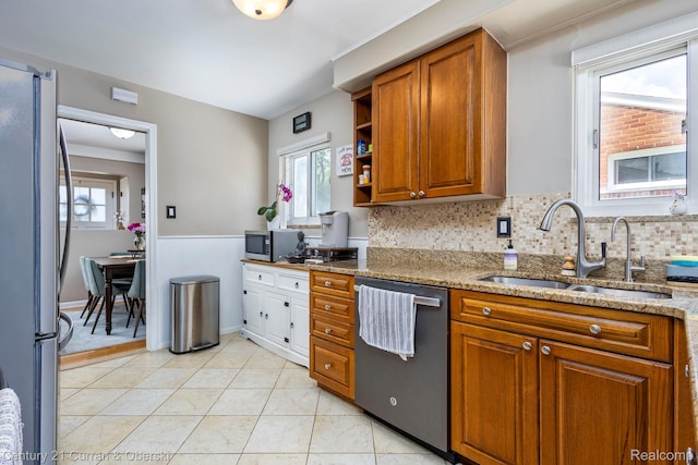 32204 Leelane, Farmington, MI 48336 - kitchen with appliances with stainless steel finishes, brown cabinetry, light stone countertops, tasteful backsplash, and open shelves