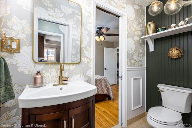 32204 Leelane, Farmington, MI 48336 - half bath featuring wallpapered walls, vanity, wood finished floors, and a ceiling fan