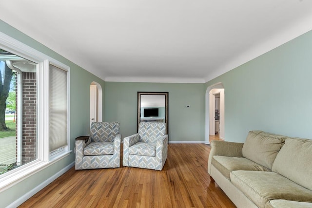 437 Collindale Ave NW, Grand Rapids, MI 49504 - living area with arched walkways and wood finished floors