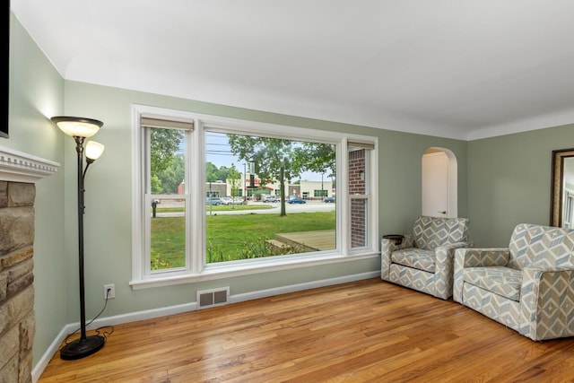437 Collindale Ave NW, Grand Rapids, MI 49504 - living area featuring wood finished floors and arched walkways