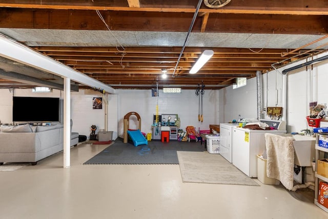 437 Collindale Ave NW, Grand Rapids, MI 49504 - unfinished below grade area featuring washing machine and clothes dryer