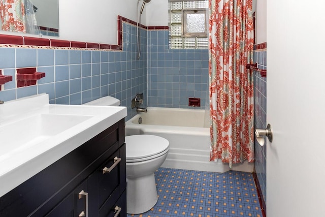 437 Collindale Ave NW, Grand Rapids, MI 49504 - full bathroom with shower / bath combo, tile walls, vanity, and wainscoting