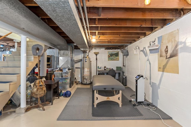 437 Collindale Ave NW, Grand Rapids, MI 49504 - unfinished below grade area featuring gas water heater and stairway