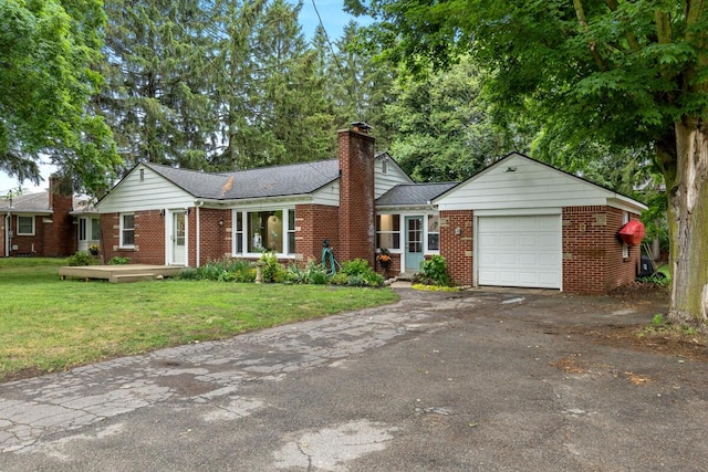 437 Collindale Ave NW, Grand Rapids, MI 49504 - ranch-style home featuring brick siding, an attached garage, asphalt driveway, and a chimney