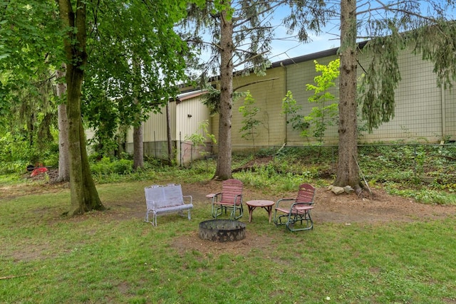 437 Collindale Ave NW, Grand Rapids, MI 49504 - view of green lawn featuring an outdoor fire pit