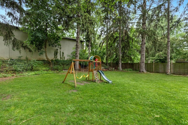 437 Collindale Ave NW, Grand Rapids, MI 49504 - fenced backyard featuring a playground