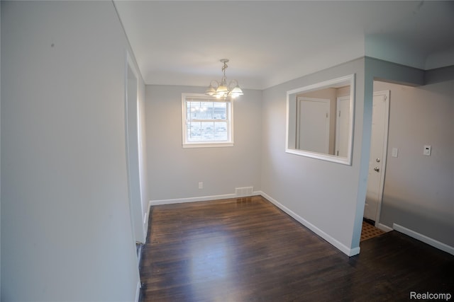 22613 Raven Ave, Eastpointe, MI 48021 - unfurnished room with a chandelier and dark wood-style flooring