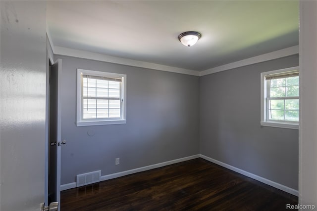 22613 Raven Ave, Eastpointe, MI 48021 - empty room with dark wood-style flooring and baseboards