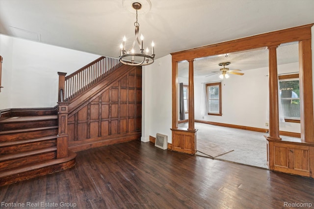 1 Grand Blvd, Battle Creek, MI 49015 - unfurnished dining area with decorative columns, stairway, a chandelier, and wood finished floors