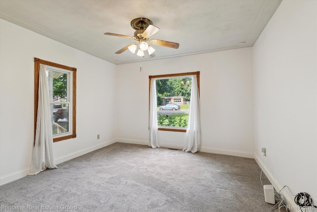1 Grand Blvd, Battle Creek, MI 49015 - carpeted empty room with a ceiling fan and baseboards