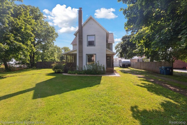 1 Grand Blvd, Battle Creek, MI 49015 - rear view of property featuring a chimney
