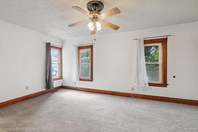 1 Grand Blvd, Battle Creek, MI 49015 - carpeted spare room featuring plenty of natural light, a textured ceiling, and ceiling fan