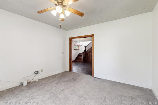 1 Grand Blvd, Battle Creek, MI 49015 - spare room featuring carpet, stairs, a ceiling fan, and a chandelier